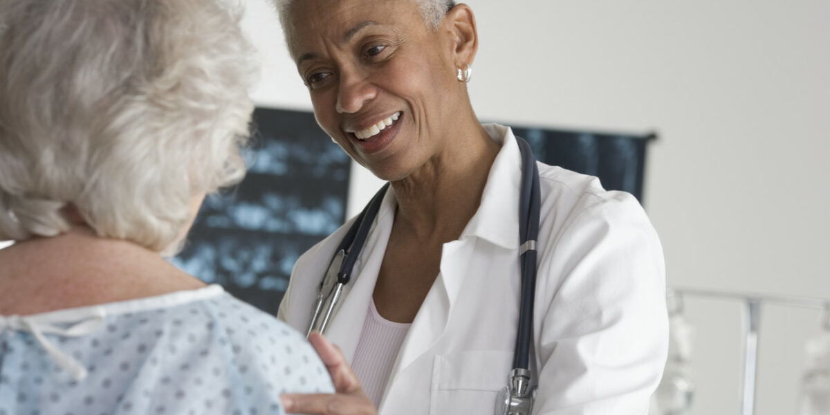 Doctor Speaking with Patient --- Image by © Royalty-Free/Corbis